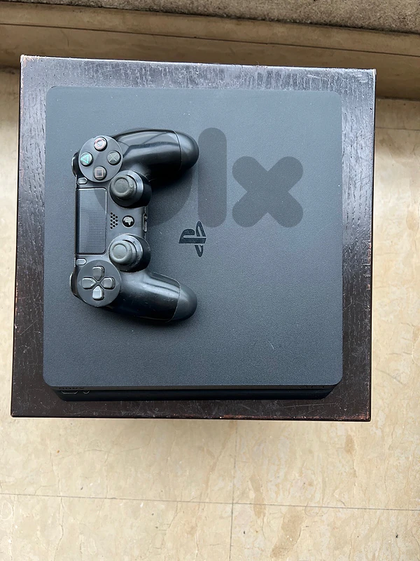 Playstation 4 slim with controller (price NOT negotiable)