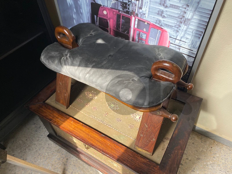2 old leather leg rest