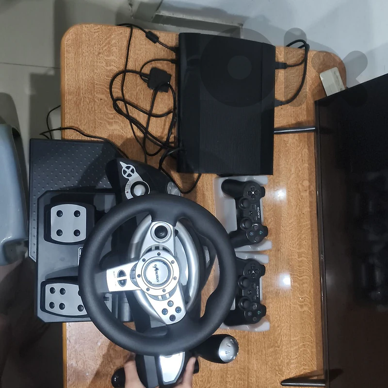 PS3 with all new accessories and 2 new controllers+steering wheel