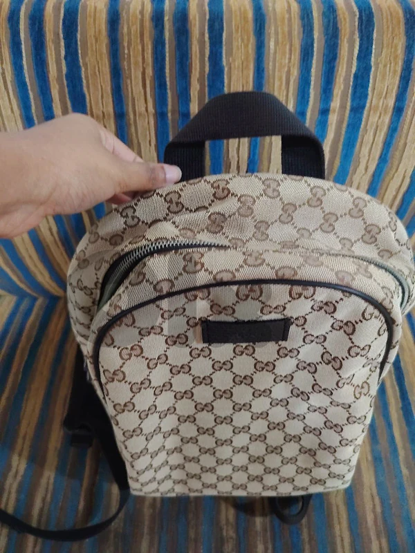 100% authentic Gucci GG monogram canvas backpack with leather trim