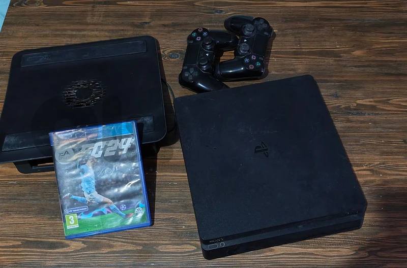 PS4 Slim + 2 Controllers + EA FC 24 Game & Cooling Pad