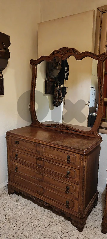 Old fashioned solid-wood bedroom dresser with framed mirror