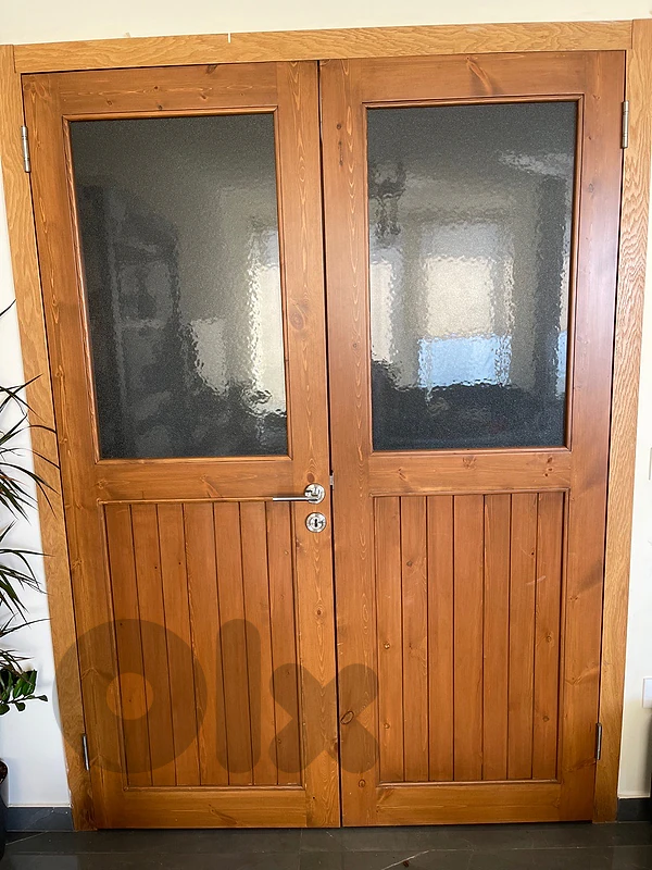 a double door, wood and glass, indoor use