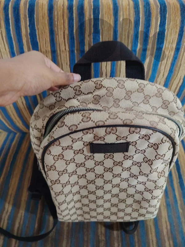 100% authentic Gucci GG monogram canvas backpack with leather trim