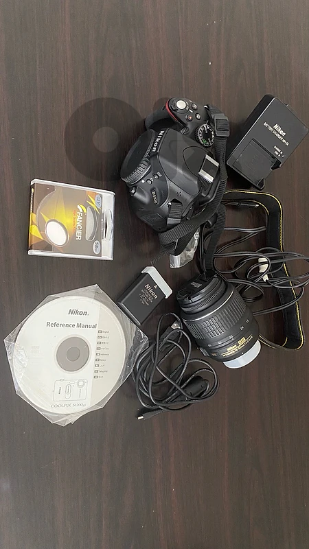 Nikon DSLR digital camera D5100 with 15-88 mm lens