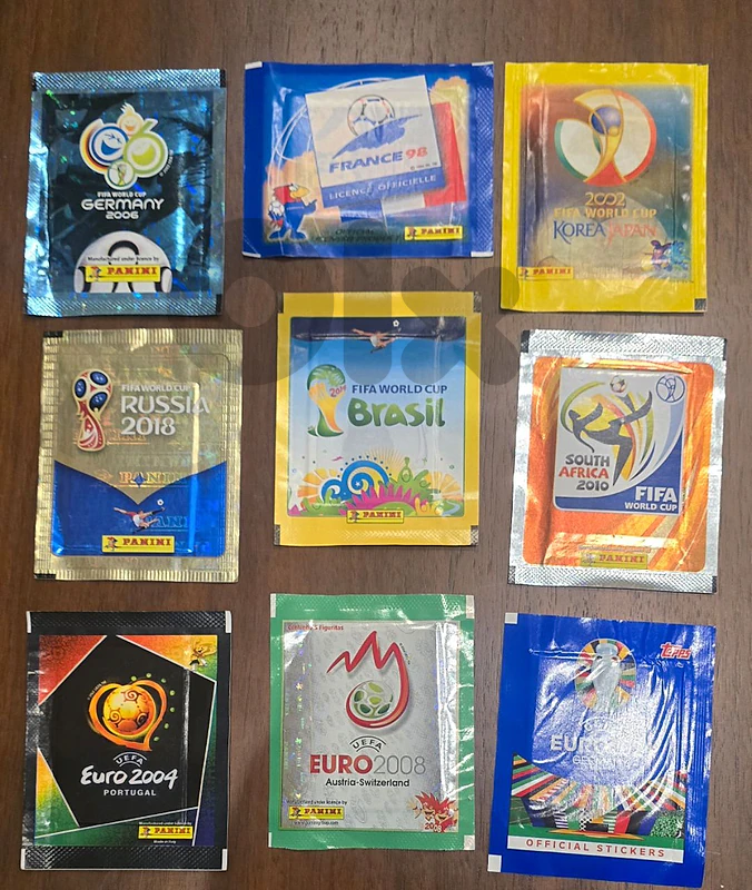 Collection of 9 collectible football sticker packets from Panini
