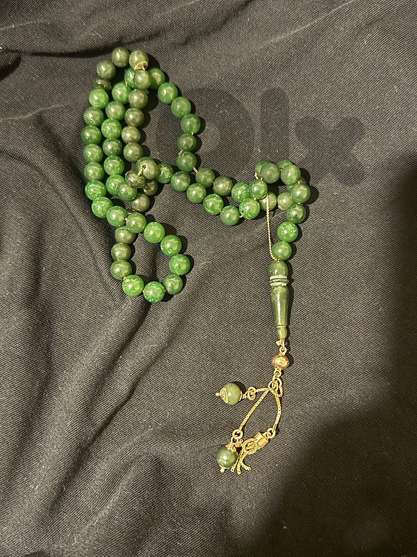 gold prayer bead
