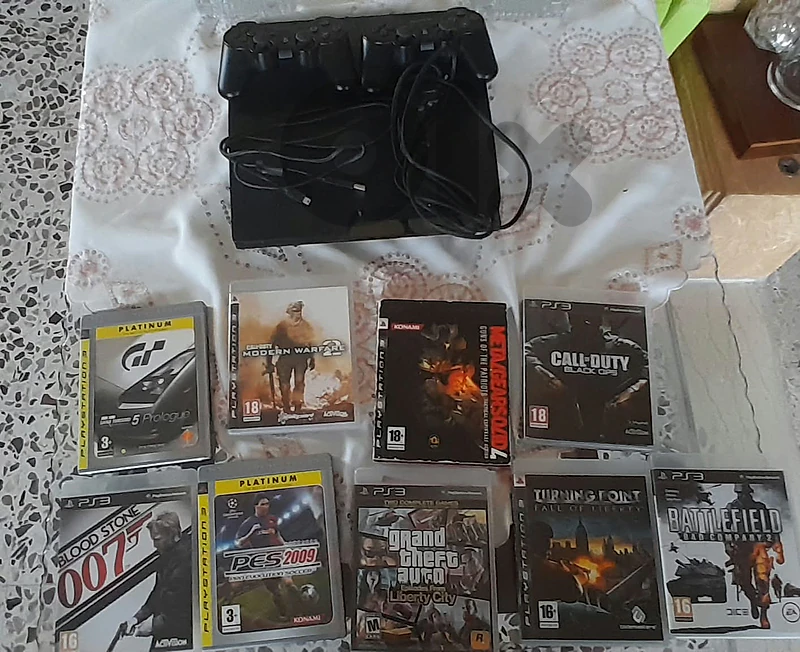 ps3 2 original controllers++7games installed+7cd's