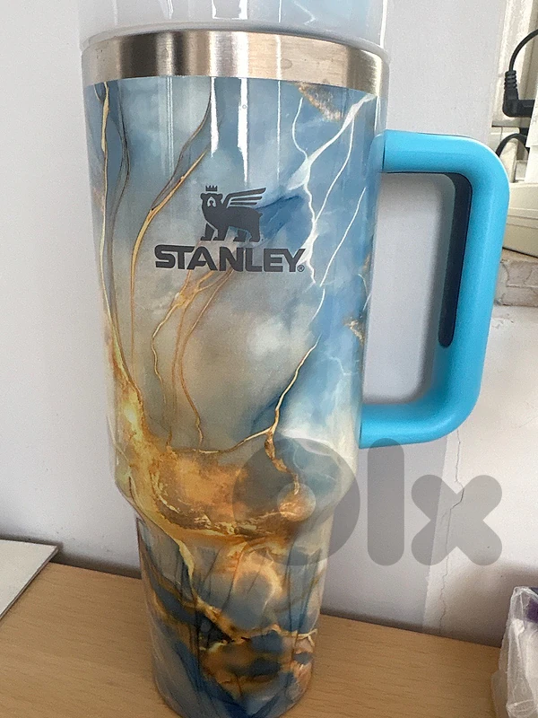 Stanley-branded insulated travel cup with a large handle