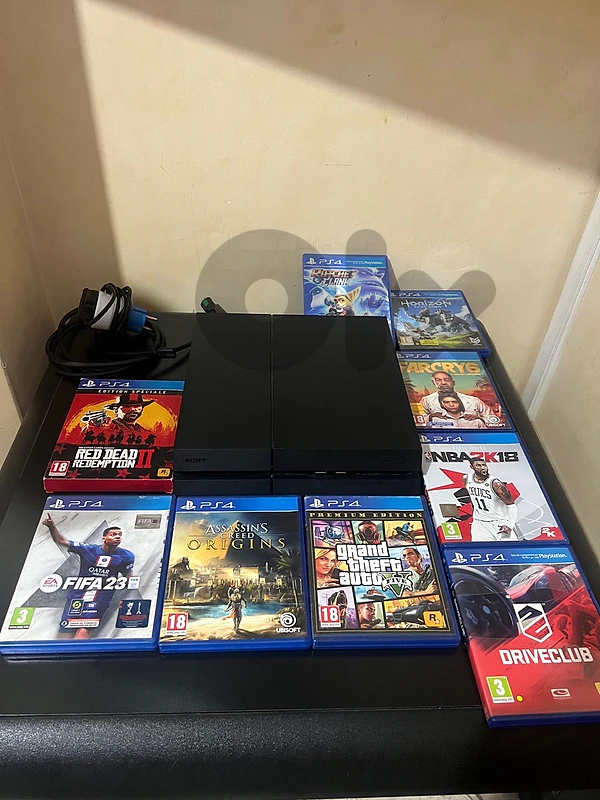 PS4 LIKE NEW WITH 9 GAMES AND ALL CABLES INCLUDED (no controller)