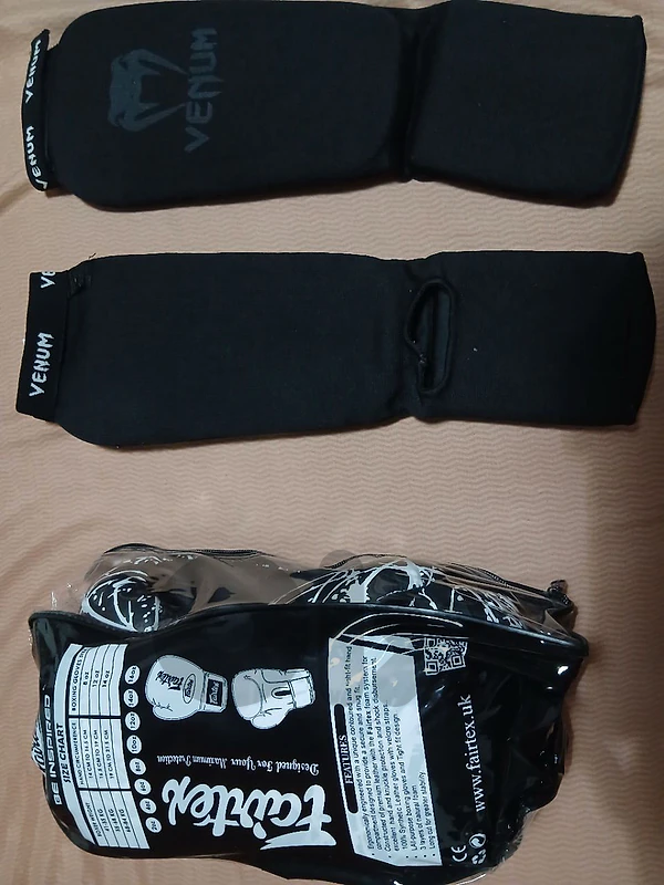 12 oz Boxing gloves and shin guards(brand new)