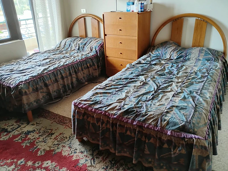 Two single beds with large nightstand