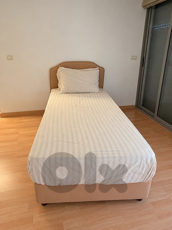 2 beige single beds + 2 mattresses + bedside table