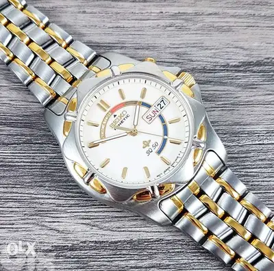 Seiko kinetic SQ50 day & date.