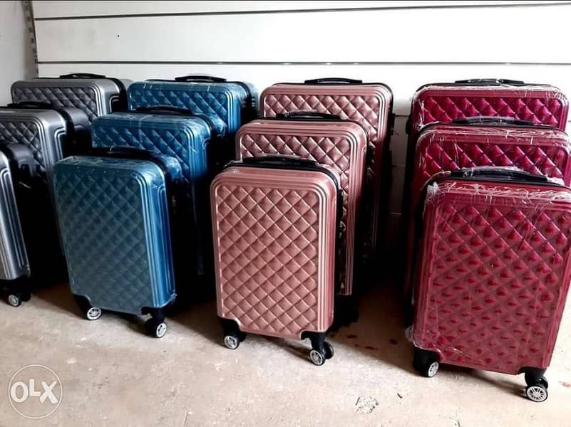 Travel suitcase different colors available by set 76-969O37 0