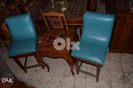 2 blue leather bar chairs with table