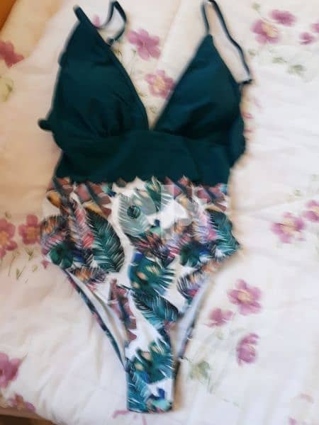 swimsuit size 40 , 25 dollars 0