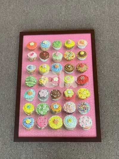 cupkcakes puzzle with a wooden frame and glass