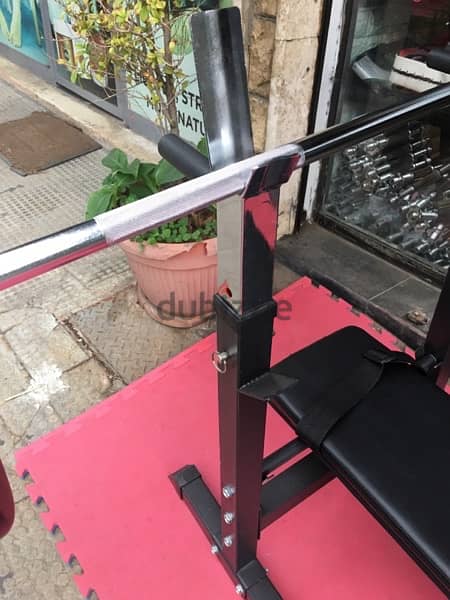 bench adjustable with adjustable rack with axe and weights all new 3