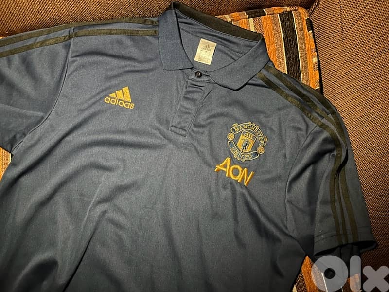 polo adidas blue manchester united 2020 jersey 0