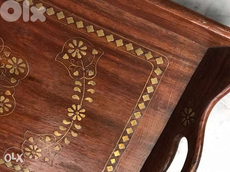 Wooden Tray with brass design pieces on it 1