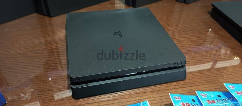 playstation 4 slim European with 2 controller all cable and 2 games 7
