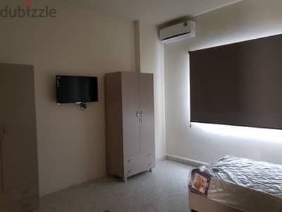Bed in a dorm for girls (foyer) للبنات فقط