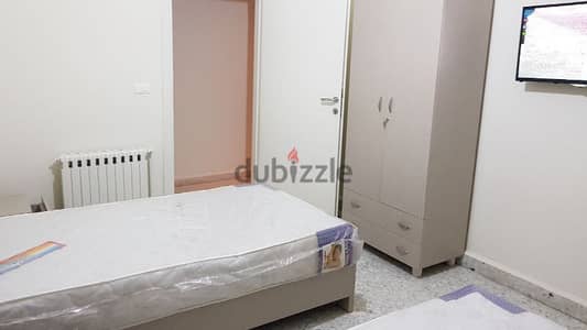 Bed in a dorm for girls (foyer) للبنات فقط